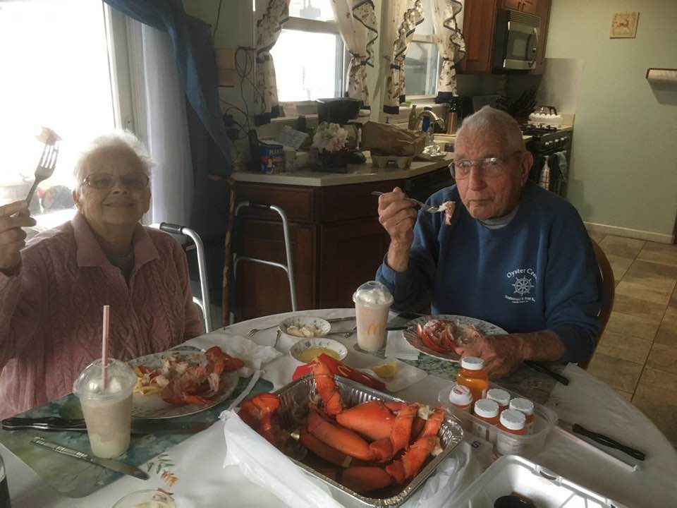 Don with his parents sharing lobster at the table