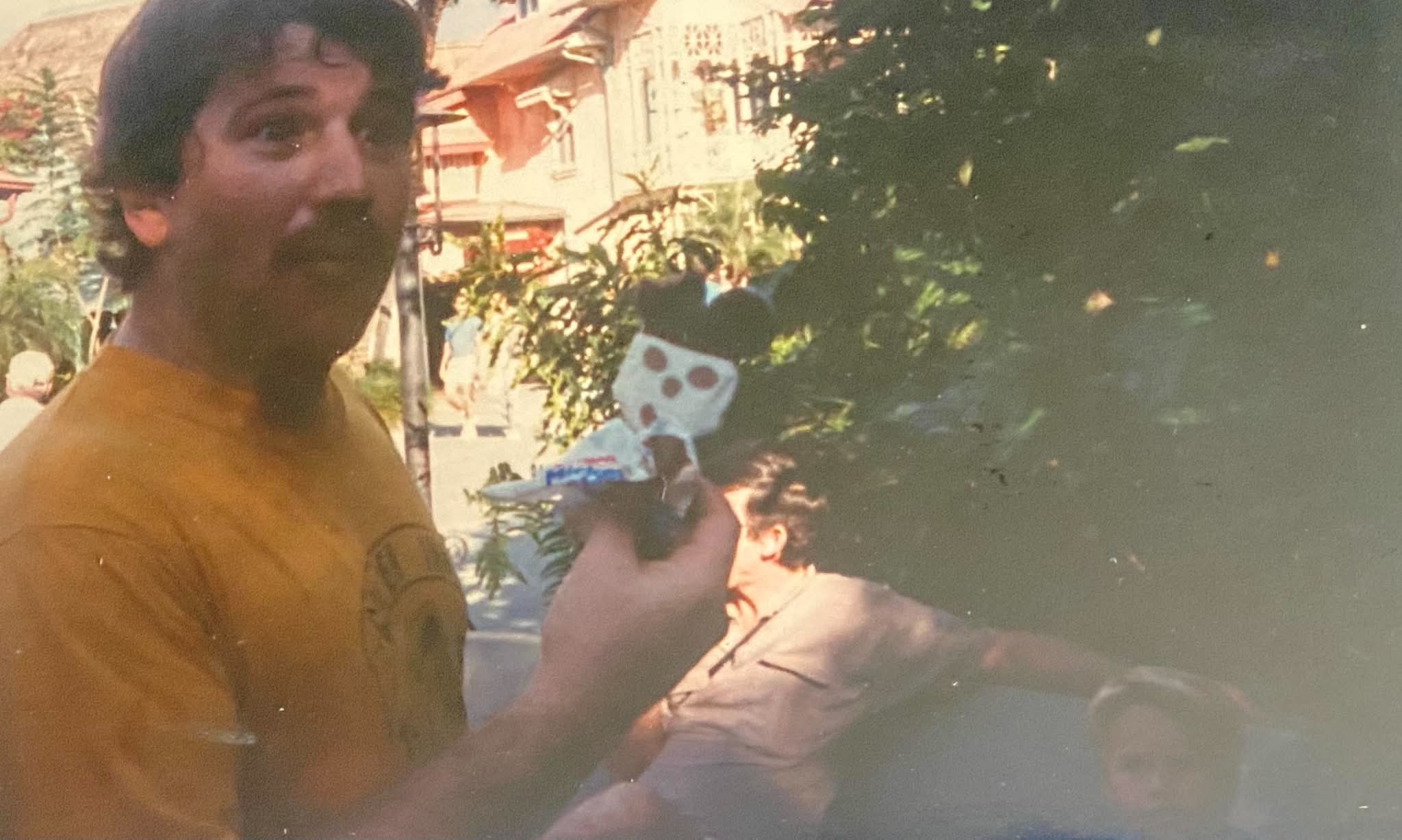 Young Don smiling with a Mickey ice cream bar